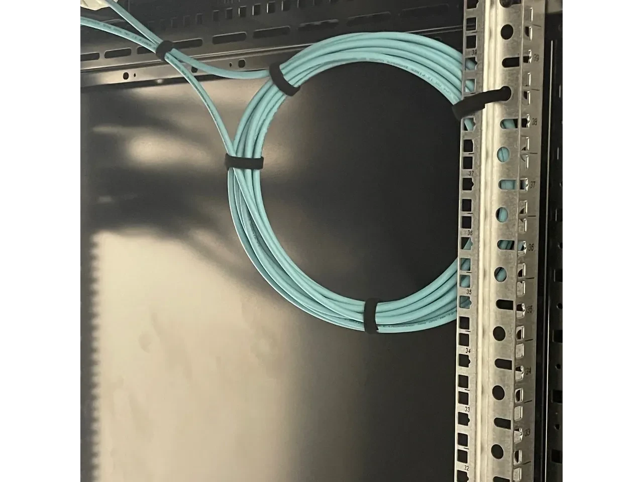 Blue network cable management inside a server rack