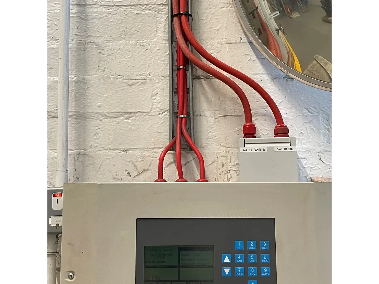 Electrical control panel with installed red cabling