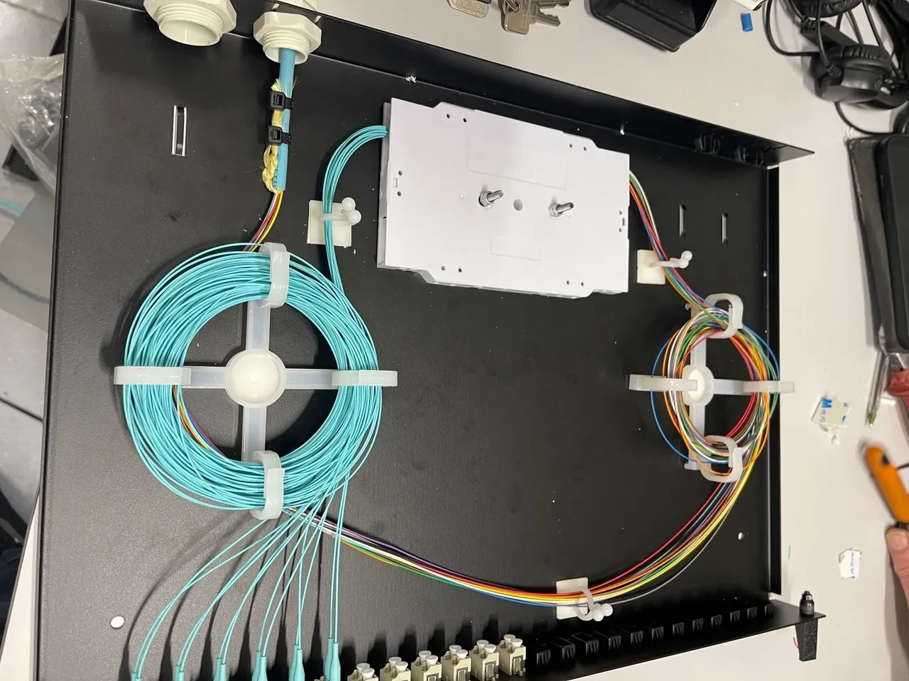 Fibre optic cable termination and organised connections